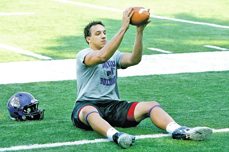  Staff Photo DAVID GOTTSCHALK C.J. O&#8217;Grady, Fayetteville tight end, catches passes during a drill at practice Monday at Harmon Field in Fayetteville.