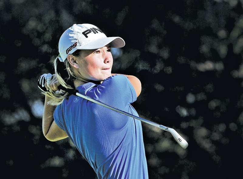 Staff Photo BEN GOFF &#8226; @NWABenGoff Brooke Matthews, Rogers High sophomore, tees off on hole No. 8 during Wednesday&#8217;s golf meet with Siloam Springs at Lost Springs Golf Course in Little Flock.