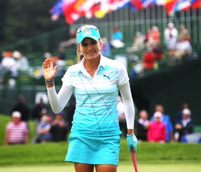 Lexi Thompson waves after her birdie on the 18th hole during the first round of the LPGA  Championship,Thursday, Aug. 14, 2014 at Monroe Golf Club in Pittsford, N.Y. (AP Photo/Democrat & Chronicle, Jamie Germano)  MAGS OUT; NO SALES