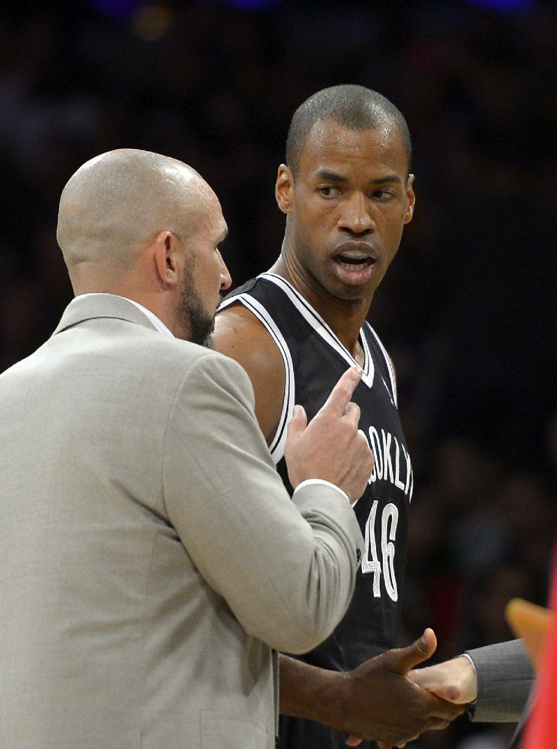 Brooklyn Nets center Jason Collins, right, talks with head coach Jason Kidd during the second half of an NBA basketball game against the Los Angeles Lakers, Sunday, Feb. 23, 2014, in Los Angeles. The Nets won 108-102. (AP Photo/Mark J. Terrill)