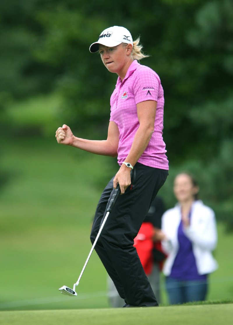 Stacy Lewis pumps her fist after putting on the 13th hole during the first round of the LPGA  Championship,Thursday, Aug. 14, 2014 at Monroe Golf Club in Pittsford, N.Y. (AP Photo/Democrat & Chronicle, Jamie Germano)  MAGS OUT; NO SALES