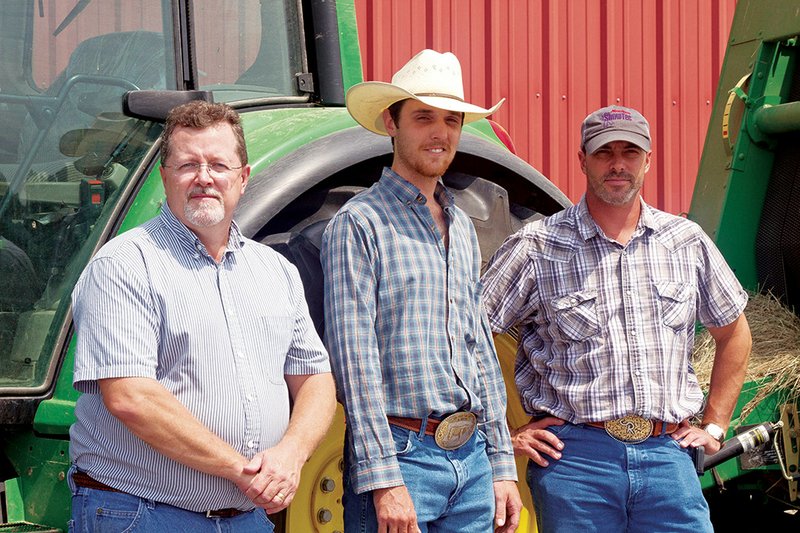 From left, Assistant Professor of Agriculture Jerry Sites, Farm Manager Brandon Martin and Assistant Professor of Agriculture Chuck Wisdom stand in front of a tractor on the Arkansas State University-Beebe farm.
