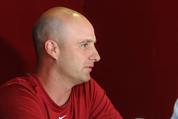 Arkansas tight ends coach Barry Lunney Jr. answers questions during the school's media day Sunday, Aug. 11, 2013 at the Fred W. Smith Football Center in Fayetteville.