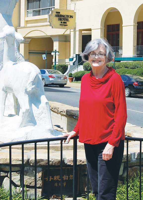 Suzanne Davidson, a member of the Hot Springs Board of Directors and the Arkansas Arts Council, is working to coordinate the repairs on the Mother Nature statue and fountain in a traffic island on Central Avenue in downtown Hot Springs. Originally designed to be made of bronze, the 21-year-old statue was made from fiberglass, marble dust, steel and chicken wire by sculptor Xu Long Hua, a Hot Springs resident.