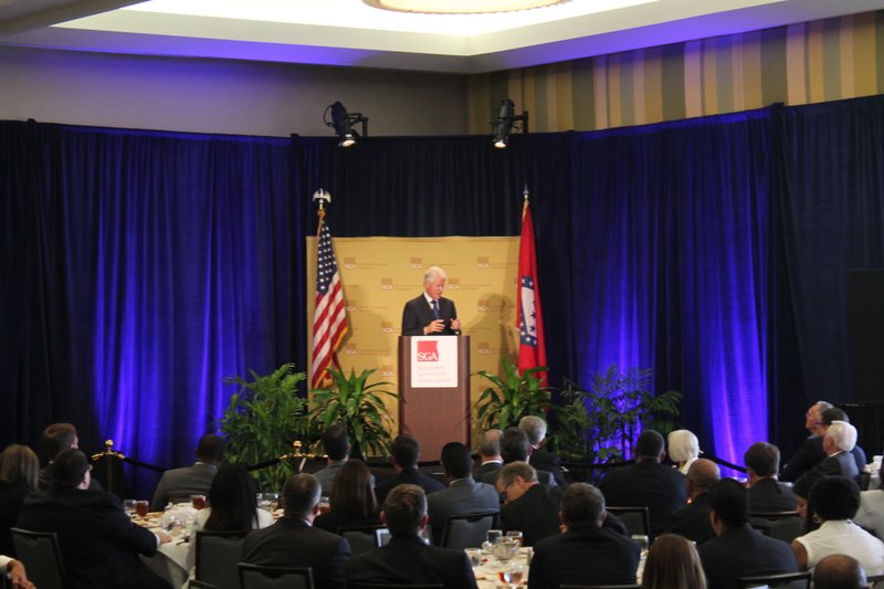 Former President Clinton speaks at the Southern Governors' Association's conference Friday. Clinton was asked there by Governor Mike Beebe who said it was special as this would be Beebe's last conference as chairmen and he and Clinton had come into politics at around the same time. 