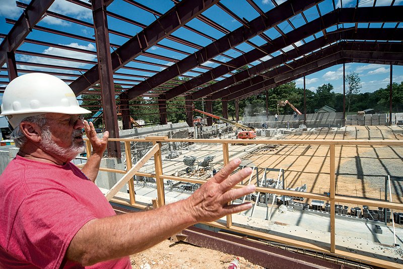 Donald Rowlett, facilities coordinator for the Quitman School District, talks about the $5.3 million Bulldog Complex under construction by Moser Construction of Bryant. The facility, which will be the first gym built in the district since the 1960s, is scheduled to be completed in May 2015. Architects for the project are Lewis, Elliott, McMorran, Vaden, Ragsdale and Woodward of Little Rock. The old gym will be used for elementary physical education, Rowlett said.