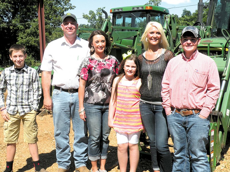 The Kevin Morris family of Williford is the 2014 Sharp County Farm Family of the Year. Family members are, from left, Garrett, Kevin, Jodi, Lily Ann, Whitney and Austin. They raise cattle and hay on their 2,150-acre farming operation.