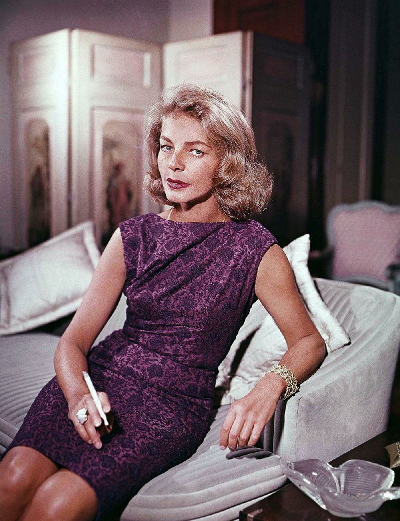This 1965 file photo shows actress Lauren Bacall at her home in New York. Bacall, the sultry-voiced actress and Humphrey Bogart’s partner off and on the screen, died Tuesday in New York. She was 89.