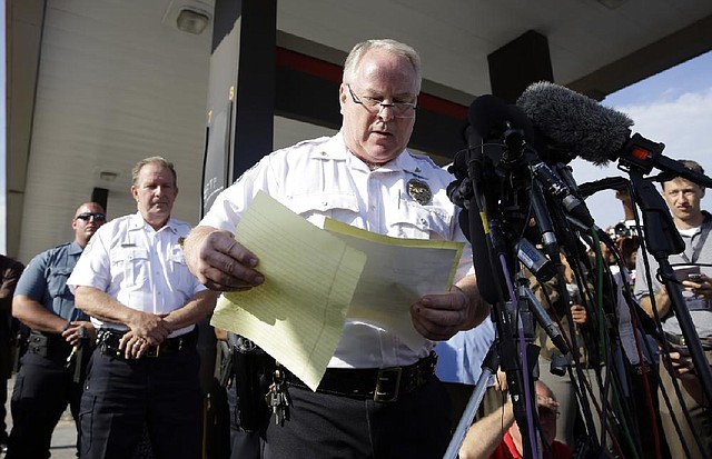 Police Chief Thomas Jackson, at a news conference Friday, releases the name of the Ferguson, Mo., police officer who killed Michael Brown.