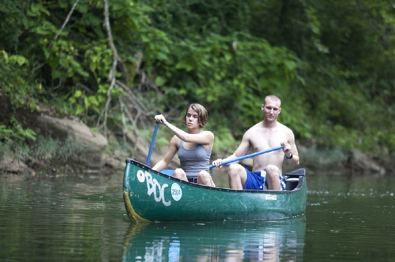 RYAN MCGEENEY/Arkansas Democrat-Gazette --08-16-2014-- Lauren Crobet, left, and Alex Preisser[cqrm], both of Dallas, Texas, make their way down the Buffalo National River after putting in Saturday morning near Pruitt. Although water levels in the Upper Buffalo have finally become too low to float, the 2014 float season has been the longest consistent season in memory due to a series of rains throughout the Ozarks.