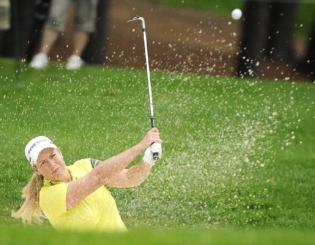 Brittany Lincicome blasts out of a trap on the 16th hole during the Wegmans LPGA golf championship in Pittsford, N.Y., Saturday, Aug. 16, 2014. (AP Photo/Gary Wiepert)