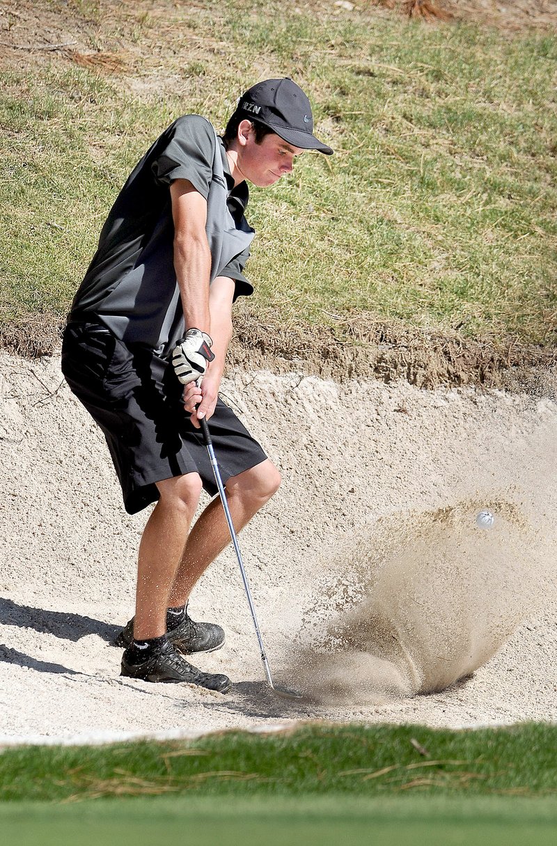 Ben Goff/NWA Media Siloam Springs sophomore Cody Beyer hits from a bunker on No. 6 during the Panthers&#8217; dual golf match against Rogers at Lost Springs Golf and Athletic Club in Little Flock on Wednesday.