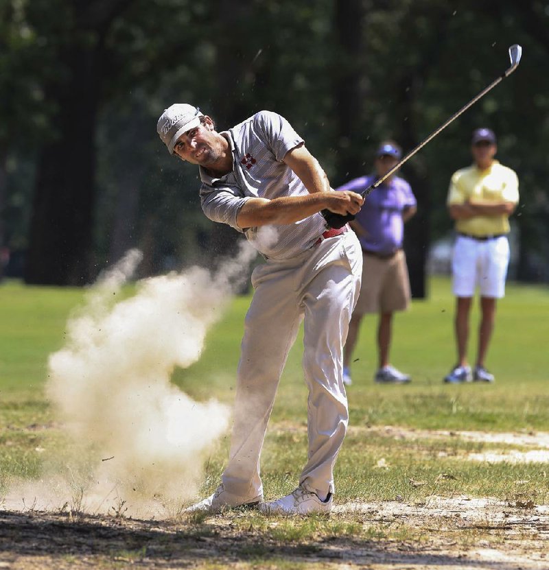 Arkansas Democrat-Gazette/RICK MCFARLAND--08/17/14--   Drew Greenwood, of Hot Springs, hits from a dirt patch off the fairway of the 6th hole Sunday in the finals of the ASGA Match Play state championship at The Greens at North Hills in Sherwood.
