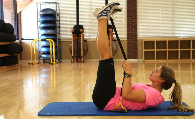 Arkansas Democrat-Gazette/CELIA STOREY
Paisley Sowell does the first step of the Active Single Leg Lift exercise at Little Rock Racquet Club for ActiveStyle's Master Class column.