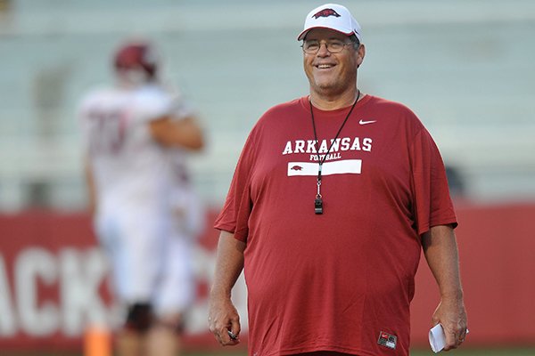 Arkansas offensive coordinator Jim Chaney watches during a practice on Wednesday, Aug. 13, 2014 at Razorback Stadium in Fayetteville. 