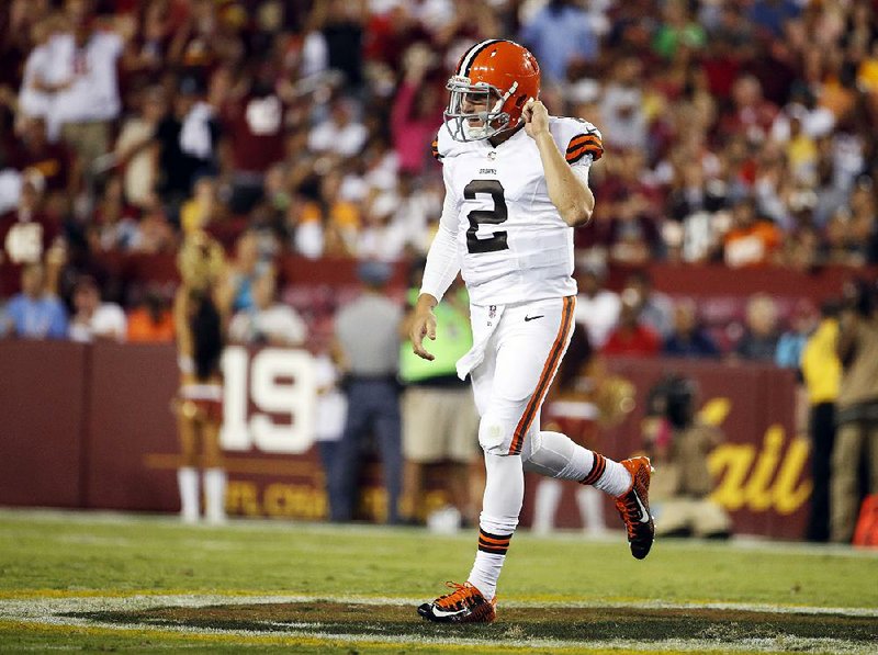 Cleveland Browns quarterback Johnny Manziel (2) jogs off the field during the first half of an NFL preseason football game against the Washington Redskins Monday, Aug. 18, 2014, in Landover, Md. (AP Photo/Evan Vucci)