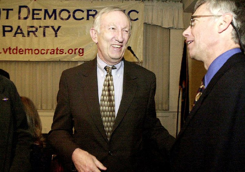 FILE - In this March 14, 2003, file photo, Sen. Jim Jeffords, I-Vt., center, laughs with Vermont Democratic Party Chairman Scudder Parker at the annual Democratic Party dinner in Montpelier, Vt. Jeffords, who in 2001 tipped control of the Senate when he quit the Republican Party to become an independent, died Monday, Aug. 18, 2014, in Washington. He was 80. (AP Photo/Toby Talbot, File)