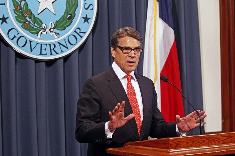 Gov. Rick Perry makes a statement in Austin, Texas on Saturday, Aug. 16, 2014 concerning the indictment on charges of coercion of a public servant and abuse of his official capacity. Perry is the first Texas governor since 1917 to be indicted. (AP Photo/Michael Thomas)