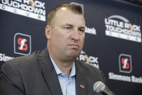 Arkansas NCAA football coach Bret Bielema listens to a question at a news conference in Little Rock, Ark., Tuesday, Aug. 19, 2014. Bielema was in central Arkansas to appear before the Little Rock Touchdown Club. (AP Photo/Danny Johnston)