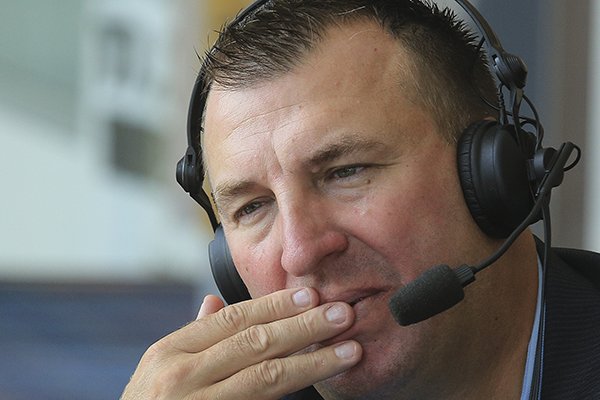Arkansas football coach Bret Bielema does a radio interview Tuesday, Aug. 19, 2014 before speaking at the opening week of the little Rock Touchdown Club. 