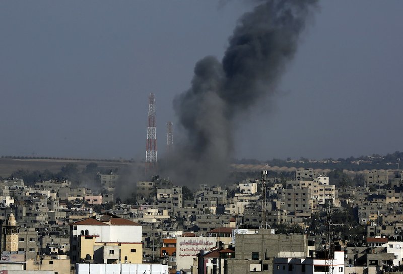 Smoke rises after an Israeli strike hit Gaza City in the northern Gaza Strip on Tuesday, Aug. 19, 2014. The Israeli military said it carried out a series of airstrikes Tuesday across the Gaza Strip in response to renewed rocket fire, a burst of violence that broke a temporary cease-fire and endangered negotiations in Egypt over ending the month long war between Israel and Hamas. The fighting occurred some eight hours before a temporary truce was set to expire. 