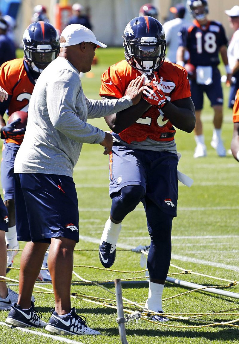 Denver running back Montee Ball goes through drills Tuesday after returning to camp in Englewood, Colo.