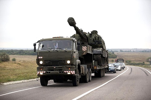 A Russian military truck carries a MSTA-S self-propelled howitzer about 6 miles from the Russia-Ukrainian border control point at Donetsk, Rostov-on-Don region, Russia, on Tuesday.