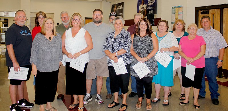 Submitted Photo Pictured with their certificates of appreciation for safe bus driving are: Sherry Curry (front, left), Lisa King, Janice Arnold, Pam Harrelson, Sammie Cunningham, Gayle Murphy, Blake West (back, left), Belinda Haslett, David Nelson, Pat Shimer, Keith Sexson, Bobby Hogan, Kelli Talvitie and transportation director Jason Barrett.