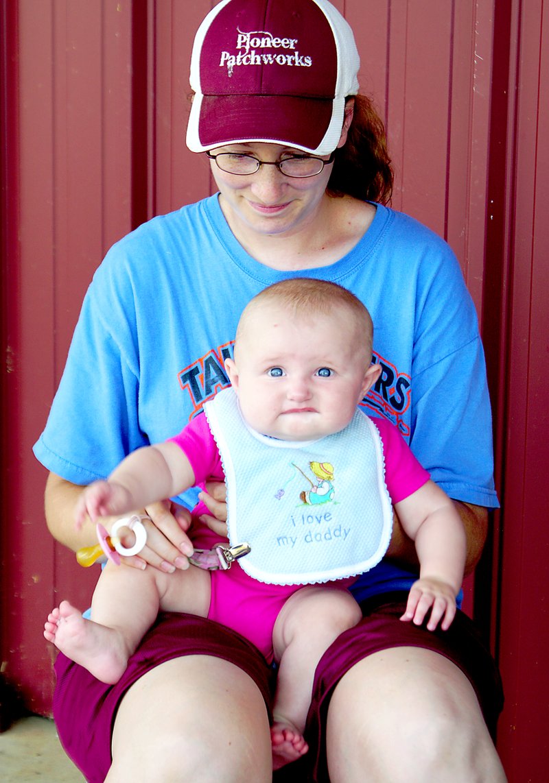 One of the youngest area visitors at the Benton County Fair on Saturday was April Millsap, 5 months, with her mother Kristi.