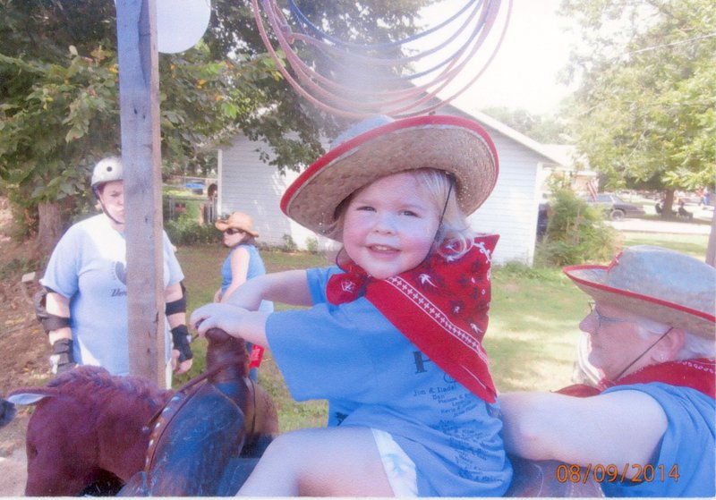 Submitted photo Little Sophie Lee Payne of Bentonville was &#8220;ridin&#8217; high&#8221; on the Payne Family float on Gravette Day. Theme of the float was &#8220;Don&#8217;t Mess With the Payne Gang.&#8221; Sophie is the granddaughter of Donald and Nancy Payne of Bentonville. Her grandmother, Nancy, is pictured at the right.