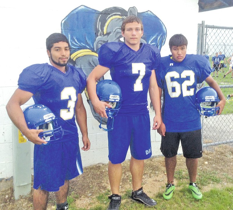 Staff Photo Paul Nielsen Allan Castaneda, left, Victor Urquidi and Hector Aguilar are part of a strong senior class at Decatur.
