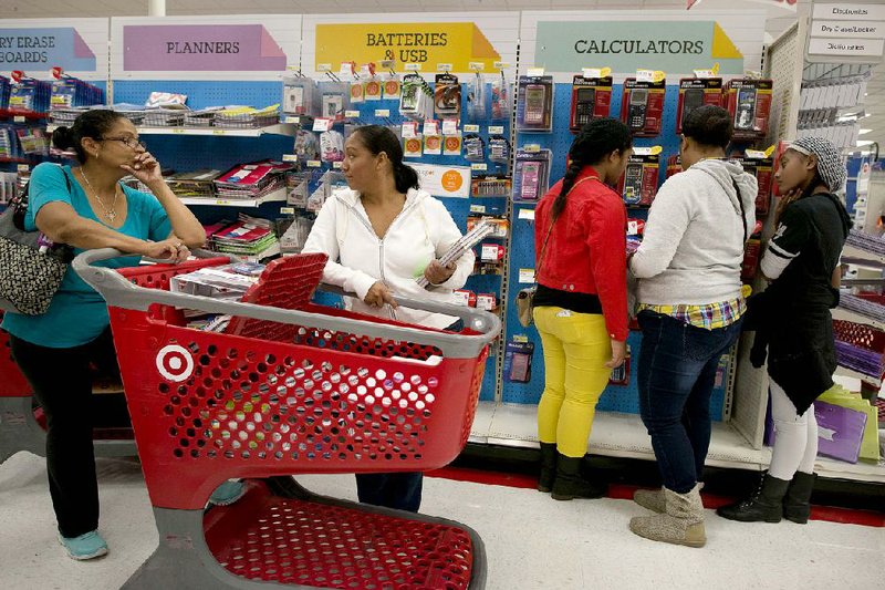 Customers shop for back-to-school supplies at a Target Corp. store in Colma, Calif., on Aug. 9. Target said Wednesday it earned $234 million in the quarter ended Aug. 2.