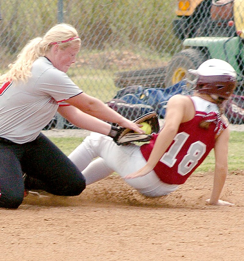 RICK PECK MCDONALD COUNTY PRESS McDonald County third baseman Chloe Anderson puts the tag on a Nevada runner in the Lady Mustangs 4-1 win during a three-team scrimmage held Saturday at MCHS.