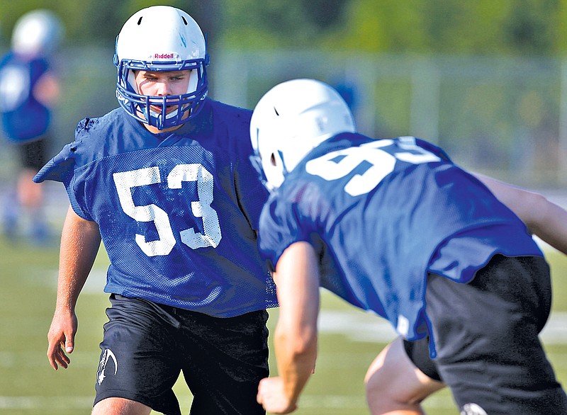 File Photo Jason Ivester Tanner Campbell, left, and Ben Madden will anchor the Rogers High defensive line.