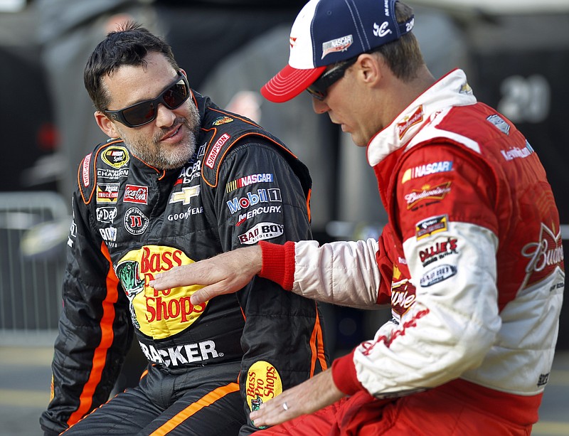 The Associated Press STILL OUT: Tony Stewart, left, here talking with Kevin Harvick in May before qualifying for a NASCAR Sprint Cup series event at Charlotte Motor Speedway in Concord, N.C., is skipping Saturday night's race in Bristol, Tenn., the third race he has missed since his car struck and killed driver Kevin Ward Jr. Aug. 9 at an upstate New York dirt track.