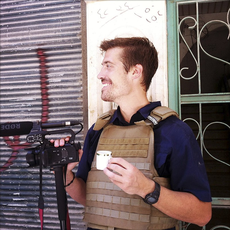 The Associated Press DEVOTED JOURNALIST: This photo posted on the website freejamesfoley.org shows journalist James Foley in Aleppo, Syria, in July, 2012. In a horrifying act of revenge for U.S. airstrikes in northern Iraq, militants with the Islamic State extremist group have beheaded Foley and are threatening to kill another hostage, U.S. officials say.
