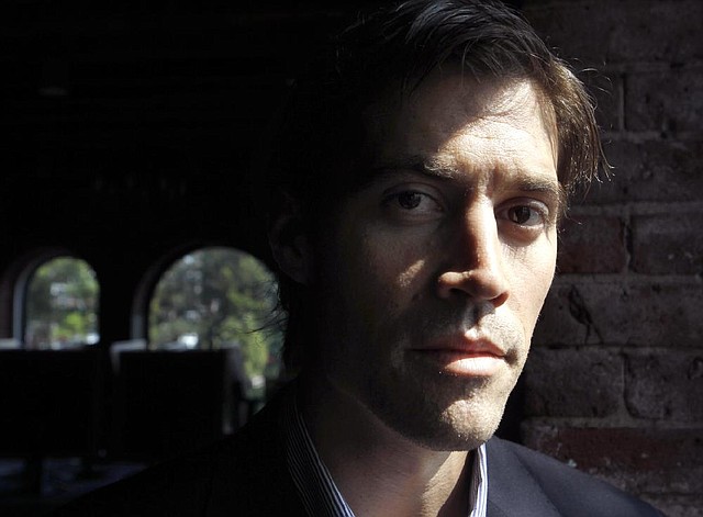 FILE - In this May 27, 2011, file photo shows American Journalist James Foley, of Rochester, N.H., as he poses for a photo in Boston. The beheading of Foley has forced a new debate over how the United States balances its unyielding policy against paying ransom to terrorist groups and saving the lives of Americans being held hostage by some of the worlds most dangerous extremists. (AP Photo/Steven Senne, File)