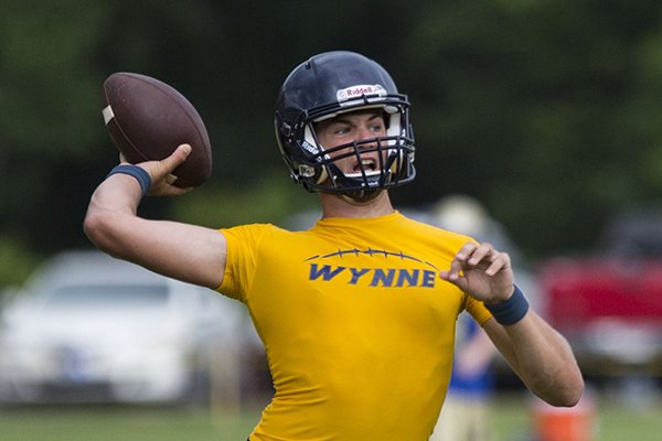 Wynne quarterback Ross Trail throws a pass at the Southern Shootout at Mighty Bluebird Complex on June 20, 2014.