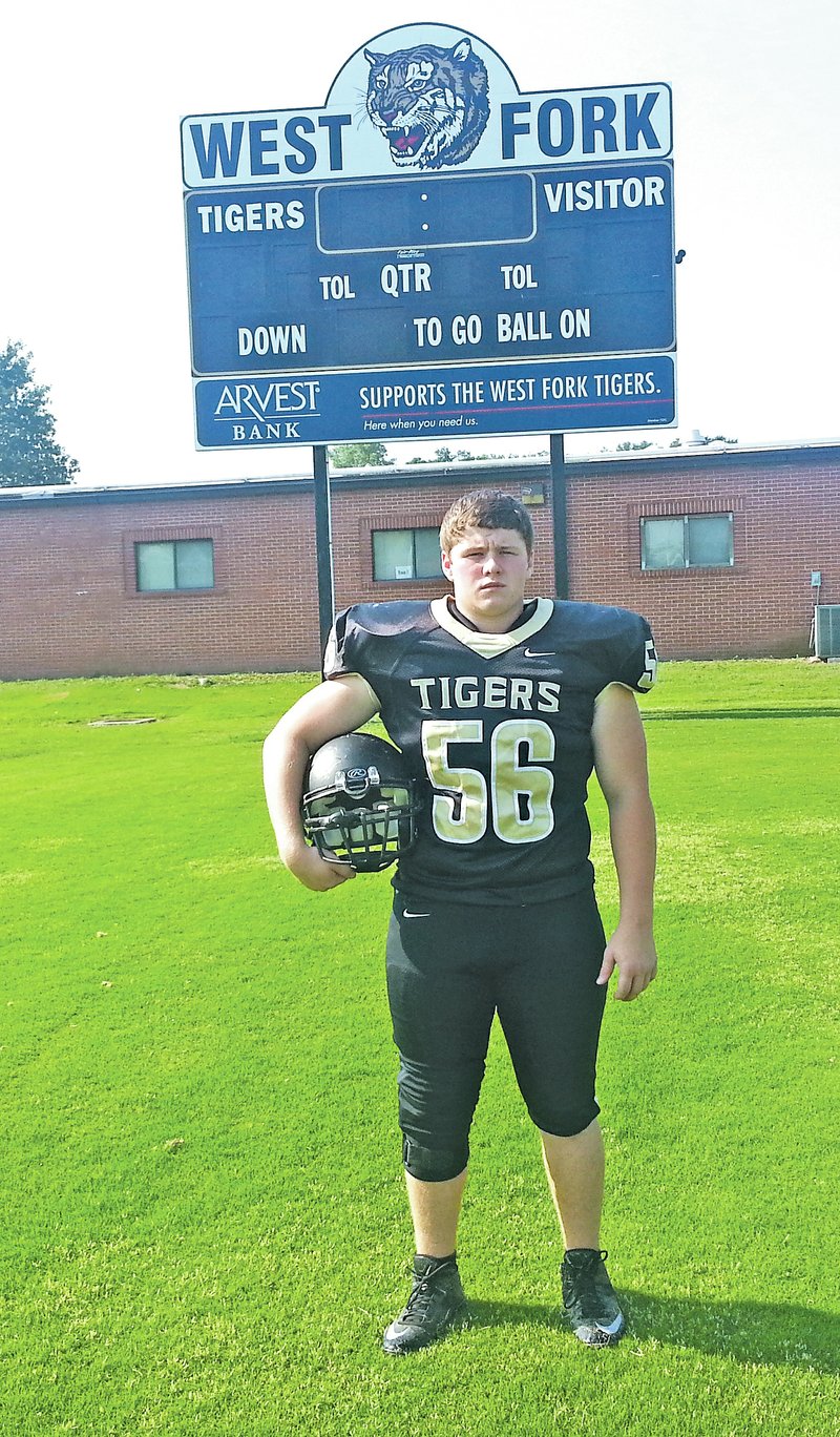 STAFF PHOTO PAUL BOYD Austin Russell, West Fork senior, has battled back from two significant injuries and will anchor the Tigers&#8217; offensive and defensive lines this season.