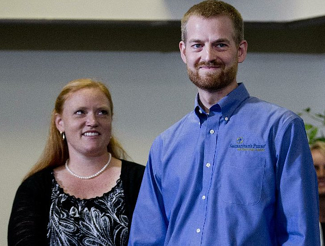 Ebola victim Dr. Kent Brantly stands with his wife, Amber, during a news conference after being released from Emory University Hospital, Thursday, Aug. 21, 2014, in Atlanta. Another American aid worker, Nancy Writebol, who was also infected with the Ebola virus, was released from the hospital Tuesday. (AP Photo/John Bazemore)