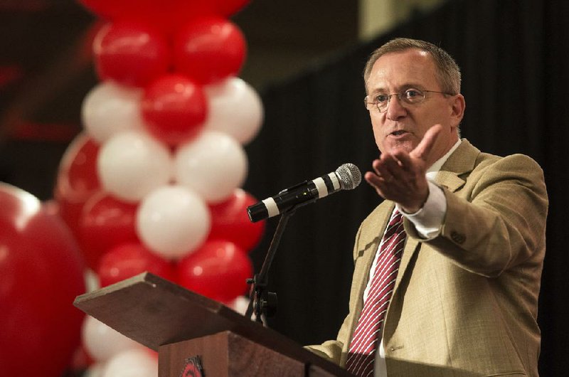 Jeff Long, University of Arkansas athletic director, gives a few remarks Friday, Aug. 22, 2014 at the 2014 Arkansas Football Kickoff Luncheon at the Northwest Arkansas Convention Center in Springdale. 