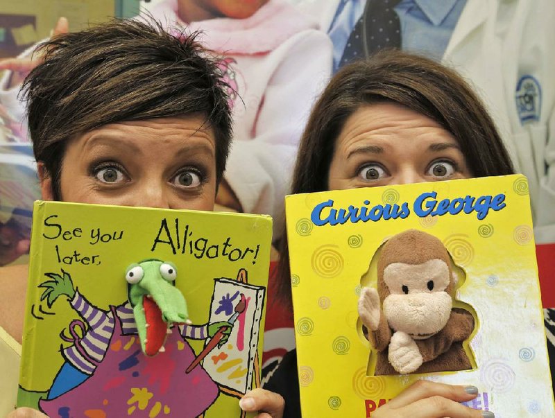 Arkansas Democrat-Gazette/JOHN SYKES JR - HIGH PROFILE VOLUNTEERS -  Amber Richart (left) and Tasha Ward are Reach Out & Read's Prescription for Success fundraiser volunteers.