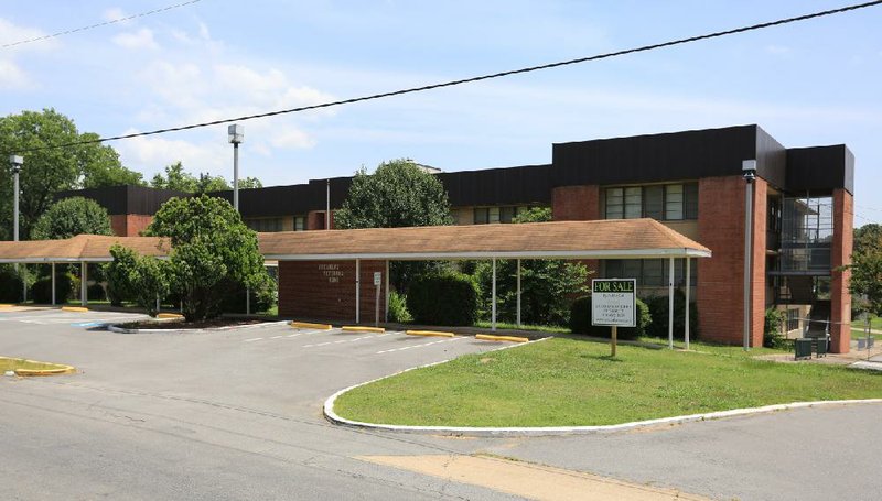 Arkansas Democrat-Gazette/RICK MCFARLAND --06/27/13--  A for sale sign is posted in front of the The Arkansas Veterans Home at 4701 West Charles Bussey Avenue in Little Rock Thursday.