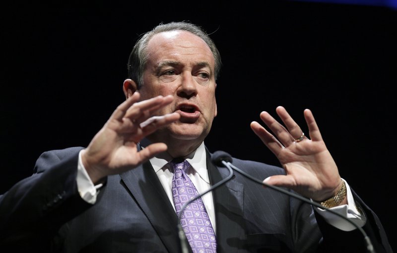 This Aug. 9, 2014, file photo shows Former Arkansas Gov. Mike Huckabee as he speaks during The Family Leadership Summit, in Ames, Iowa. Conservatives should stop the fight over Common Core and instead consider the benefits that the academic standards offer students in struggling schools, Huckabee said. The position puts him at odds with a significant bloc of Republicans. 