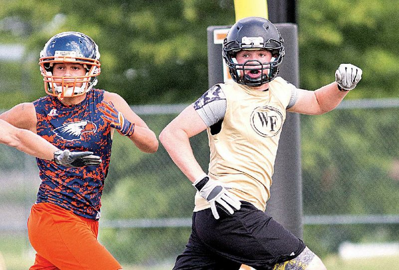 West Fork wide receiver Briant Bowerman (right) is expected to be one of quarterback Colton Wise’s favorite targets this season. The Tigers return seven starters on offense and eight on defense.