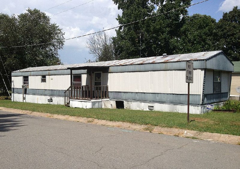 Arkansas Democrat-Gazette/ELYSSA CHERNEY --8/23/14-- A man and a woman were found fatality shot Friday night in this trailer at 15300 Vine St. in Alexander.