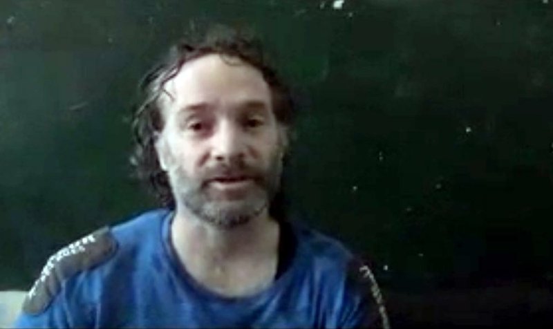 In this image made from undated video obtained by The Associated Press, which has been authenticated based on its contents and other AP reporting, a man believed to be Peter Theo Curtis, a U.S. citizen held hostage by an al-Qaida linked group in Syria, delivers a statement. The U.S. government said on Sunday, Aug. 24, 2014 that Curtis, who had been held hostage for about two years, had been released. (AP Photo) 