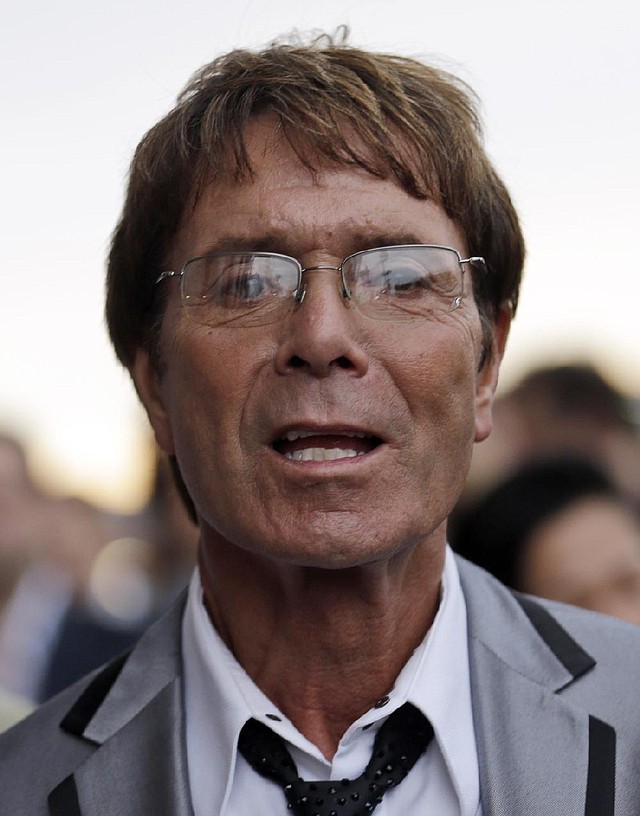 FILE - In this Friday, July 27, 2012 file photo, British singer Cliff Richard arrives for the opening ceremony at the 2012 Summer Olympics, in London. British police say they are searching a house belonging to singer Cliff Richard in connection with sexual allegations dating back to the 1980s. South Yorkshire Police say eight officers are at the house in Berkshire, west of London on Thursday, Aug. 14, 2014.  The force said the allegations "involve a boy who was under the age of 16 at the time." (AP Photo/Markus Schreiber, File)