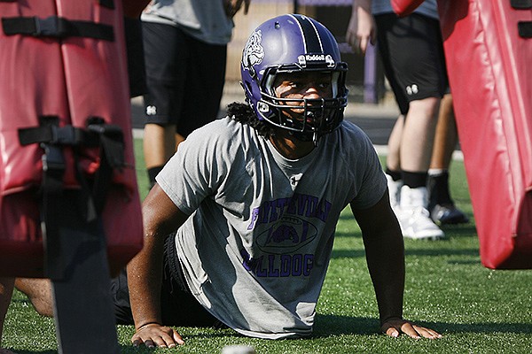 Fayetteville High School defensive lineman Damani Carter during practice Monday August 4, 2014 at Harmon Field in Fayetteville.