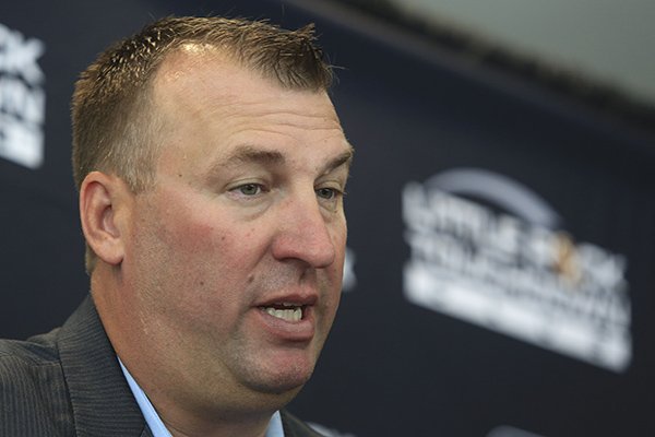 Arkansas football coach Bret Bielema answers questions for the media Tuesday, Aug. 19, 2014 before speaking at the opening week of the Little Rock Touchdown Club. 